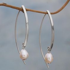 Featuring a handcrafted design from sterling silver, this pair of drop earrings is presented by Indonesian artisan Diah Arini, who works from home to create beautiful creations like these earrings. Creamy cultured pearls summon fairy tale fantasies as they dangle from shining silver bars. Sterling silver, cultured freshwater pearl Hook earrings High polish finish Handmade in & fairly traded from Indonesia Ribbon Jewelry, Printed Jewelry, Freshwater Cultured Pearls, Silver Bars, Silver Drop Earrings, Jewelry Packaging, Pearl Drop Earrings, Silver Pearls, Pearl Drop