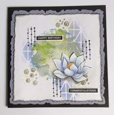 a birthday card with a watercolor lotus on the front and congratulations written in black ink