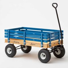 a toy blue wagon with wheels on a white background