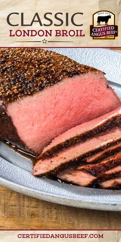 a close up of a plate of meat on a table with the words classic london broil