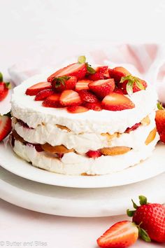 there is a cake with strawberries on it