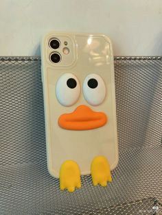 an iphone case with a cartoon character on it's back and yellow rubber feet