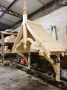 a wooden structure is being built in a workshop