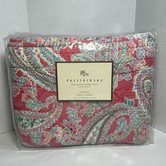 a red and blue paisley print sheet set with matching pillow cases on the bottom side