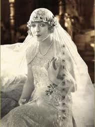 an old photo of a woman in a wedding dress