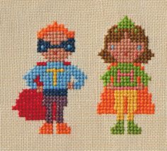 the cross stitch pattern shows two children dressed as superheros