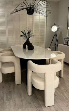 a white table and chairs in a room