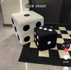 two black and white dice sitting on top of a rug