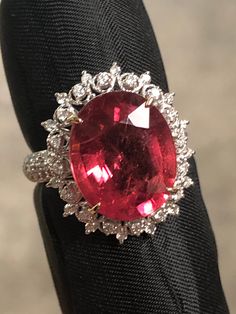 Rubelite Tourmaline Ring- Vintage style Rubelite: 6.65 cts Diamonds: 0.53 cts  G color VS2 18K White Gold 5.27 gr Size: 6.5 ( USA) Colors may slightly differ from pictures.We try our best. Will be shipped fully insured with UPS Exquisite Oval Ruby Ring Gia Certified, Elegant Tourmaline Gemstone With Center Stone, Luxury Tourmaline Gemstones With Accent Stones, Luxury Tourmaline Rings, Luxury Tourmaline Rings With Halo Setting, Luxury Tourmaline Jewelry With Halo Setting, Elegant Oval Tourmaline Gemstones, Formal Oval Topaz Ring Gia Certified, Gia Certified Oval Topaz Ring For Formal Occasions