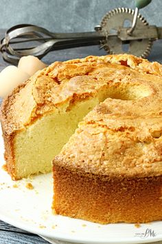 a close up of a cake on a plate with a slice cut out and ready to be eaten