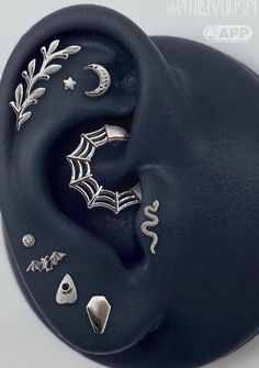 the ear is decorated with silver jewelry