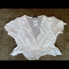 Short Sleeves Low V Cut Ruffles On The End Great Top For High Waisted Jeans Or Shorts Forever 21 Feminine Ruffled Tops, Forever 21 Ruffled Tops For Spring, Forever 21 Cotton Ruffle Top, Forever 21 Ruffled Top For Brunch, Forever 21 White Tops With Ruffles, Forever 21 White Ruffled Top, Plus Size Bohemian, White Ruffle Top, Light Pink Shorts