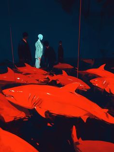 a group of people standing in front of red sharks