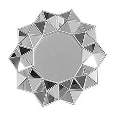 a mirror that is on top of a white surface with many small triangles around it