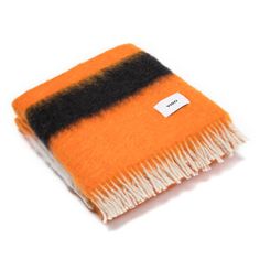 an orange and black striped scarf on a white background