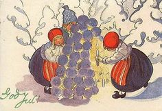 two children are standing next to a bunch of grapes in the snow, and one child is looking at them