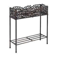 a metal shelf with an intricate design on it