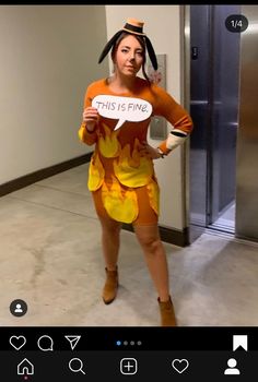 a woman in a costume holding a sign that says, this is fine on it