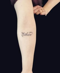 a woman with a tattoo on her leg that says,'eohn '