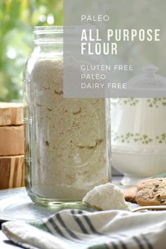 a jar filled with flour next to cookies