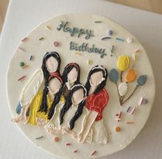 a birthday cake with three women on it