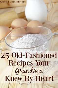 an old fashioned recipe in a glass bowl on a wooden table with eggs and flour