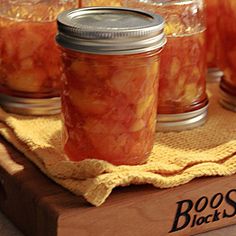 jars filled with food sitting on top of a wooden table