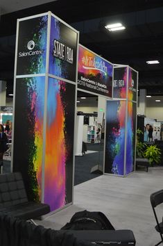 an exhibit booth with colorful paint splattered on it