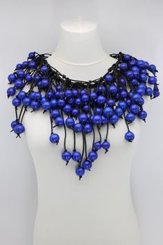 Description: Hand-woven leatherette Wooden beads cape-style necklace Length: Adjustable 45 to 55cm collar Available colours & Product codes: White - NL2112-14 Black - NL2112-01 Cobalt Blue - NL2112-35 Cobalt Blue/Gold - NL2112-3503 Gold - NL2112-03 Orange - NL2112-12 Spring Green - NL2112-10 Yellow - NL2112-40 Adjustable Large Beads Bib Necklace For Party, Adjustable Bib Necklace With Large Beads For Party, Adjustable Bib Necklaces With Large Beads For Party, Blue Bib Necklace With Large Beads, Elegant Party Necklace With Wooden Beads, Beaded Cape, Cape Style, Blue And White China, Flow Blue