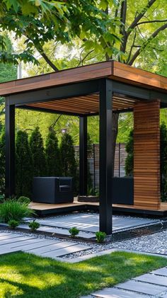 a small wooden structure sitting in the middle of a yard