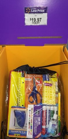 an open yellow box containing supplies for sewing