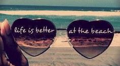 two heart shaped sunglasses with the words life is better at the beach