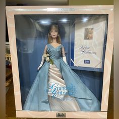 a barbie doll in a blue dress with white flowers