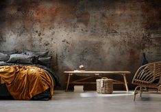 a bed sitting next to a wooden table on top of a floor