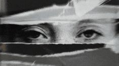 a woman's eyes are seen through the paper