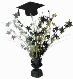 a black vase filled with stars and a graduation cap