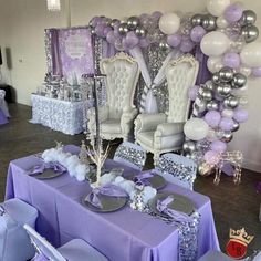 a room filled with lots of purple and silver decorations