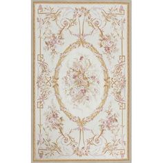 a white rug with pink flowers and gold trimmings on the bottom, in an oval