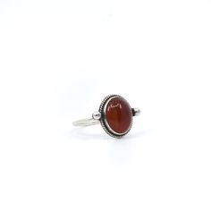 Sometimes you want to gaze down at your ring and see perfect balance and grace. That's what the Delica Dainty Ring has to offer. High- grade semi-precious stone with a simple, sterling silver design. Perfect little ring. Lovely, traditional, dainty ring of 10X12 mm Red Agate cabochon set in .925 sterling silver oxidized and burnished bezel and wire. Simple, elegant and perfect. This lovely little ring is created using traditional silversmithing techniques in my Kensington, MD studio. 10X12mm cab Bohemian Oval Agate Rings, Oval Amber Agate Ring, Adjustable Oval Amber Ring, Amber Oval Agate Ring, Amber Rings With Natural Stones, Bohemian Carnelian Round Rings, Bohemian Round Carnelian Rings, Bohemian Carnelian Rings, Adjustable Spiritual Oval Cabochon Ring