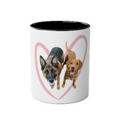 two dogs on a heart shaped coffee mug