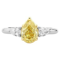 a yellow and white diamond ring