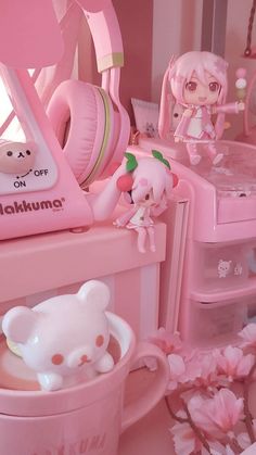 there are many pink items on the shelf in this room, including headphones and toys