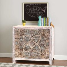 an old dresser has been decorated with intricate designs and is next to a chalkboard