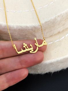 "Arabic Name Necklace, Personalized Jewelry, Arabic Necklace, Custom Arabic Necklace, Custom Jewelry, Islamic Jewelry, Christmas Gift LENGTHS * Between 13\" and 24\" * The open necklace laid straight & measured end to end. MATERIALS * Pendants and Chains are 925 Sterling Silver. COLORS * 925 Sterling Silver * Gold- Plated * Rose Gold- Plated HOW TO ORDER * Personalization Details: Please leave your name in Arabic Font in the Personalization Box Please Note That: If you put your name in Engli Meaningful Handmade Necklace For Gift, Meaningful Handmade Jewelry For Birthday Gift, Handmade Meaningful Jewelry For Birthday Gift, Customized Name Necklace Pendant, Handmade Nameplate Necklaces For Mother's Day, Handmade Nameplate Necklace For Mother's Day, Open Necklace, Arabic Name Necklace, Arabic Necklace