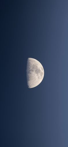 the moon is in the blue sky with no clouds