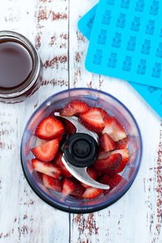 sliced strawberries in a food processor with chocolate