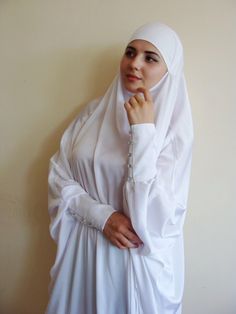 White silk long khimar with high cuffs - chic and beauty. This khimar will be a good cover for you. This outfit is good idea for engagement, hajj or wedding look! Delicate fine silk ideal for summer weather. Always keep in mind that the fabric is enlightened, at the bottom have to be the dress. An elegant way for the modest women. Buttons secure the cuffs. Be sure when ordering in the note write the length of the khimar and the girth of the wrist.We can sew khimar in any other color! This handy Muslim Dress Wedding, Long Hijab, Nikah Outfit, Engagement Look, Bridal Hijab, Dubai Abaya, Muslim Women Hijab, Muslim Dress, Muslimah Fashion Outfits