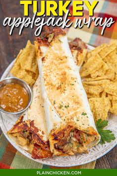 turkey appetizer wrap on a plate with tortilla chips and dipping sauce