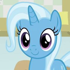 the blue pony has big eyes and is looking at something in front of it's face