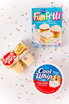 two boxes of funfetti ice cream next to some cupcakes